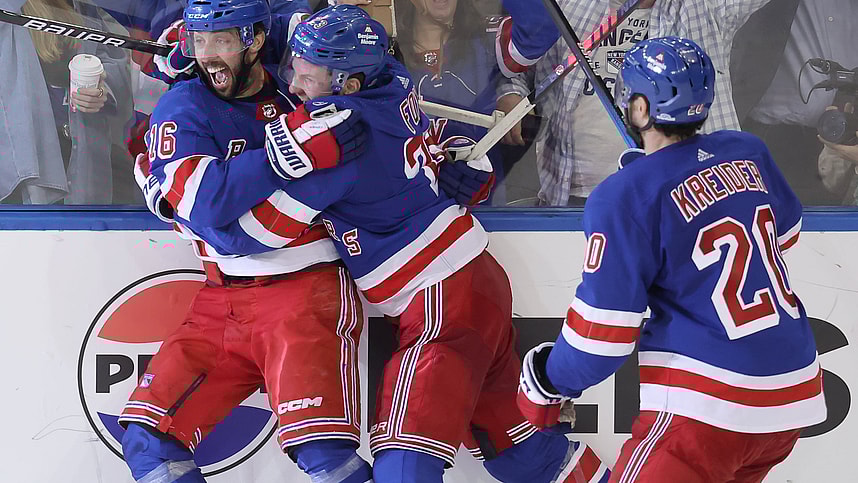 May 7, 2024; New York, New York, USA; New York Rangers center Vincent Trocheck (16) celebrates his game winning goal against the Carolina Hurricanes with defenseman Adam Fox (23) and left wing Chris Kreider (20) during the second overtime of game two of the second round of the 2024 Stanley Cup Playoffs at Madison Square Garden. Mandatory Credit: Brad Penner-USA TODAY Sports