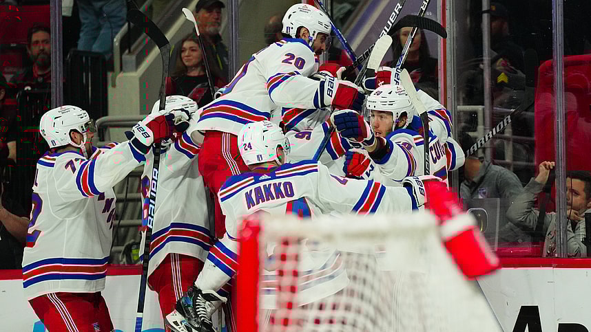 May 9, 2024; Raleigh, North Carolina, USA; New York Rangers left wing Artemi Panarin (10) is congratulated by his teammates after his goal in the first overtime against the Carolina Hurricanes in game three of the second round of the 2024 Stanley Cup Playoffs at PNC Arena. Mandatory Credit: James Guillory-USA TODAY Sports