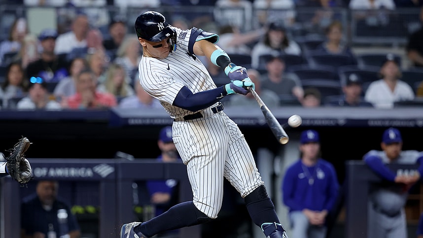 Jun 9, 2024; Bronx, New York, USA; New York Yankees right fielder Aaron Judge (99) hits a solo home run against the Los Angeles Dodgers during the eighth inning at Yankee Stadium. Mandatory Credit: Brad Penner-USA TODAY Sports