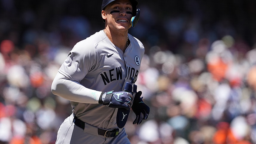 Jun 2, 2024; San Francisco, California, USA; New York Yankees center fielder Aaron Judge (99) jogs to first base after drawing a walk against the San Francisco Giants during the third inning at Oracle Park. Mandatory Credit: Darren Yamashita-USA TODAY Sports