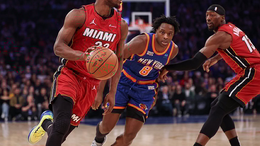 Jan 27, 2024; New York, New York, USA; Miami Heat forward Jimmy Butler (22) dribbles in front of New York Knicks forward OG Anunoby (8) and guard Evan Fournier (13) during the first half at Madison Square Garden. Mandatory Credit: Vincent Carchietta-USA TODAY Sports