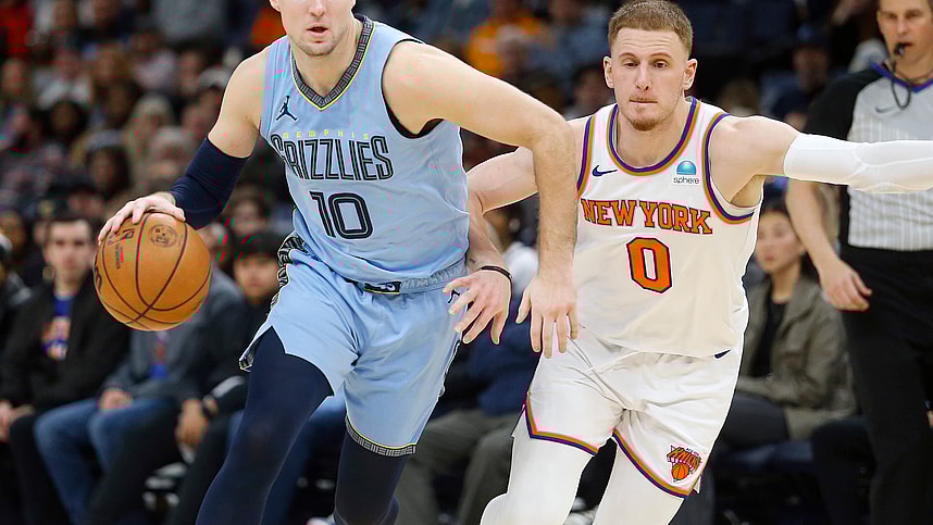 Jan 13, 2024; Memphis, Tennessee, USA; Memphis Grizzlies guard Luke Kennard (10) drives to the basket as New York Knicks guard Donte DiVincenzo (0) defends during the second half at FedExForum. Mandatory Credit: Petre Thomas-USA TODAY Sports