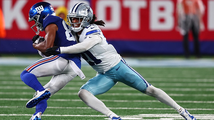 Sep 10, 2023; East Rutherford, New Jersey, USA; Dallas Cowboys cornerback Stephon Gilmore (21) tackles New York Giants wide receiver Darius Slayton (86) during the second half at MetLife Stadium. Mandatory Credit: Ed Mulholland-USA TODAY Sports