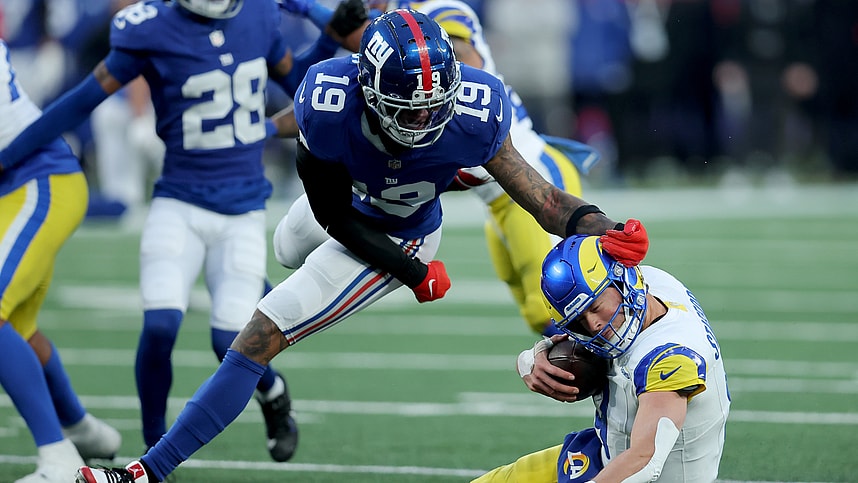 Dec 31, 2023; East Rutherford, New Jersey, USA; Los Angeles Rams quarterback Matthew Stafford (9) is sacked by New York Giants safety Isaiah Simmons (19) during the fourth quarter at MetLife Stadium. Mandatory Credit: Brad Penner-USA TODAY Sports