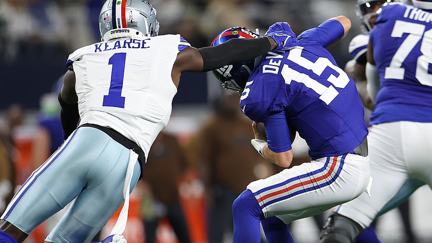 Nov 12, 2023; Arlington, Texas, USA; New York Giants quarterback Tommy DeVito (15) avoids the sack by Dallas Cowboys safety Jayron Kearse (1) during the second quarter at AT&T Stadium. Mandatory Credit: Kevin Jairaj-USA TODAY Sports