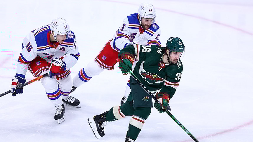 Mar 8, 2022; Saint Paul, Minnesota, USA; Minnesota Wild right wing Mats Zuccarello (36) skates with the puck as New York Rangers center Ryan Strome (16) and center Barclay Goodrow (21) defend during the third period at Xcel Energy Center. Mandatory Credit: Harrison Barden-USA TODAY Sports