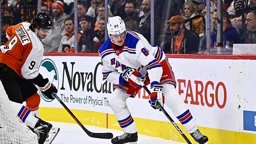 Feb 24, 2024; Philadelphia, Pennsylvania, USA; New York Rangers defenseman Jacob Trouba (8) reaches for the puck against New York Rangers center Adam Edstrom (84) in the second period at Wells Fargo Center. Mandatory Credit: Kyle Ross-USA TODAY Sports