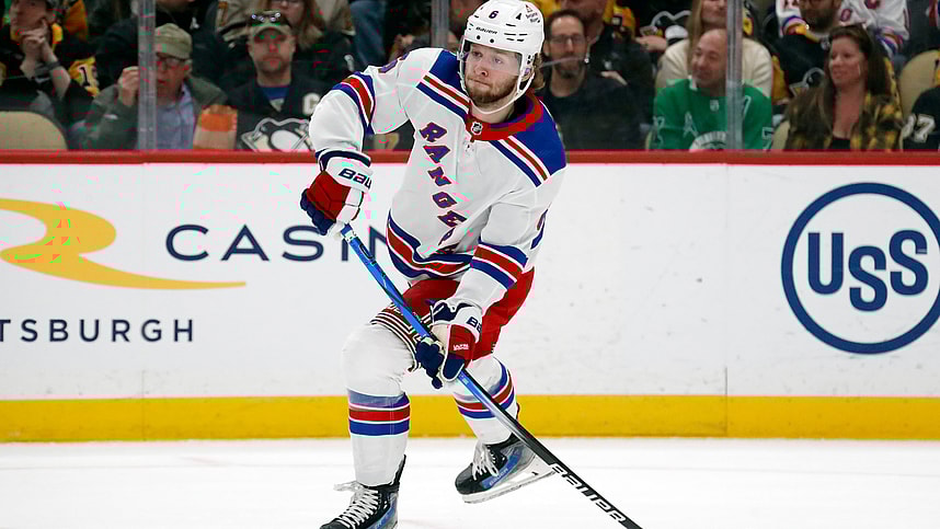Mar 16, 2024; Pittsburgh, Pennsylvania, USA; New York Rangers defenseman Zac Jones (6) passes the puck against the Pittsburgh Penguins during the first period at PPG Paints Arena. New York won 7-4. Mandatory Credit: Charles LeClaire-USA TODAY Sports