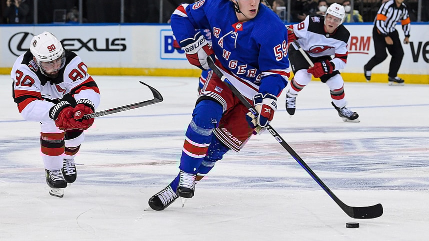 Sep 29, 2022; New York, New York, USA; New York Rangers center Karl Henriksson (59) skates with the puck against the New Jersey Devils during the third period at Madison Square Garden. Mandatory Credit: Dennis Schneidler-USA TODAY Sports
