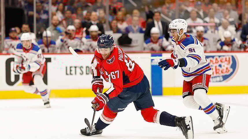 Apr 26, 2024; Washington, District of Columbia, USA; Washington Capitals left wing Max Pacioretty (67) shoots the puck as New York Rangers center Alex Wennberg (91) defends in the first period.in game three of the first round of the 2024 Stanley Cup Playoffs at Capital One Arena. Mandatory Credit: Geoff Burke-USA TODAY Sports