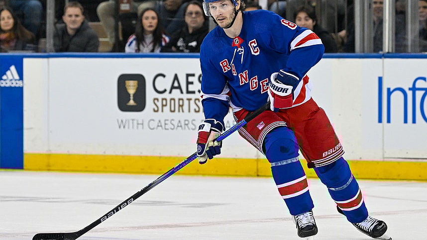 Apr 23, 2024; New York, New York, USA; New York Rangers defenseman Jacob Trouba (8) skates with the puck against the Washington Capitals during the first period in game two of the first round of the 2024 Stanley Cup Playoffs at Madison Square Garden. Mandatory Credit: Dennis Schneidler-USA TODAY Sports