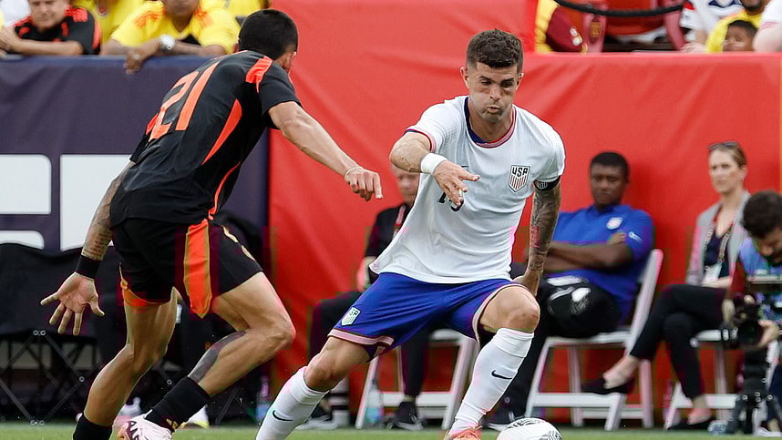 Jun 8, 2024; Landover, Maryland, USA; United States forward Christian Pulisic (10) dribbles the ball as Colombia defender Daniel Munoz (21) defends in the first half at Commanders Field. Mandatory Credit: Geoff Burke-USA TODAY Sports