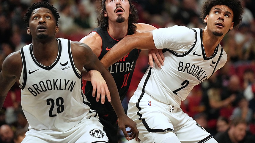 Nov 16, 2023; Miami, Florida, USA; Miami Heat guard Jaime Jaquez Jr. (11) battles for position with Brooklyn Nets forward Dorian Finney-Smith (28) and forward Cameron Johnson (2) in the first half at Kaseya Center. Mandatory Credit: Jim Rassol-USA TODAY Sports