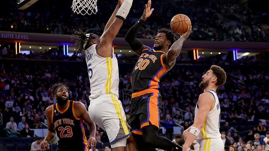 Dec 20, 2022; New York, New York, USA; New York Knicks forward Julius Randle (30) drives to the basket against Golden State Warriors center Kevon Looney (5) during the third quarter at Madison Square Garden. Mandatory Credit: Brad Penner-USA TODAY Sports