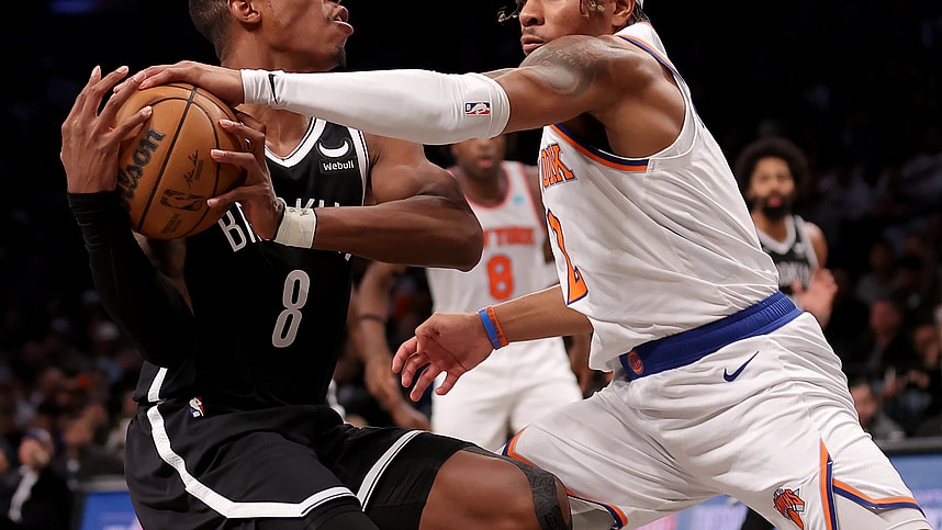 Jan 23, 2024; Brooklyn, New York, USA; New York Knicks guard Miles McBride (2) knocks the ball away from Brooklyn Nets guard Lonnie Walker IV (8) during the fourth quarter at Barclays Center. Mandatory Credit: Brad Penner-USA TODAY Sports
