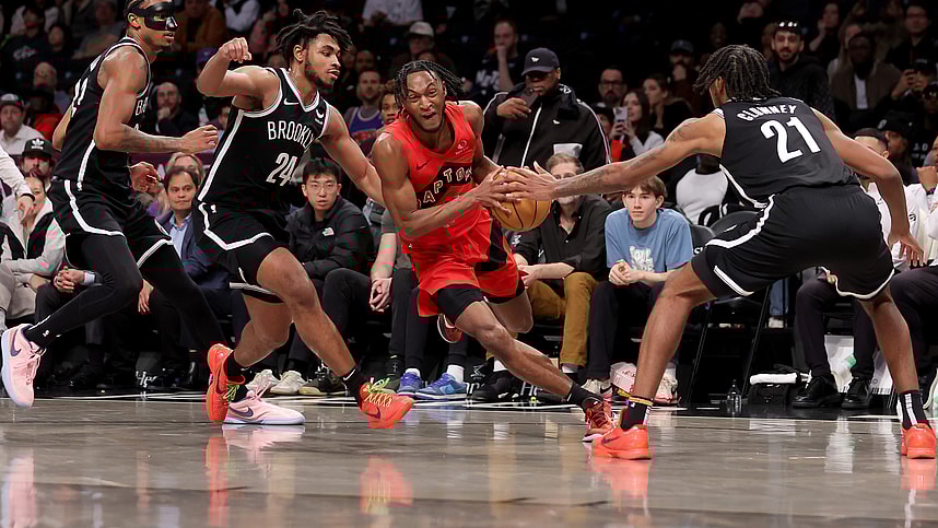 Apr 10, 2024; Brooklyn, New York, USA; Toronto Raptors guard Immanuel Quickley (5) drives to the basket against Brooklyn Nets center Nic Claxton (33) and guard Cam Thomas (24) and forward Noah Clowney (21) during the fourth quarter at Barclays Center. Mandatory Credit: Brad Penner-USA TODAY Sports