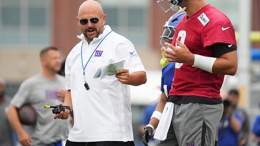 Jul 25, 2024; East Rutherford, NY, USA; New York Giants head coach Brian Daboll speaks with quarterback Daniel Jones (8) during training camp at Quest Diagnostics Training Center. Mandatory Credit: Lucas Boland-USA TODAY Sports