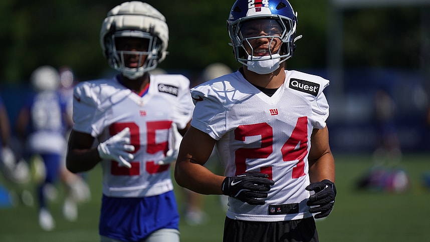 Jul 26, 2024; East Rutherford, NJ, USA; New York Giants safety Dane Belton (24) and New York Giants defensive back Alex Johnson (25) take the field during training camp at Quest Diagnostics Training Center. Mandatory Credit: Lucas Boland-USA TODAY Sports