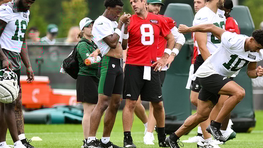 Jul 25, 2024; Florham Park, NJ, USA; New York Jets quarterback Aaron Rodgers (8) talks with wide receiver Garrett Wilson (5) during training camp at Atlantic Health Jets Training Center. Mandatory Credit: John Jones-USA TODAY Sports