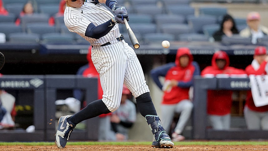 Aug 7, 2024; Bronx, New York, USA; New York Yankees designated hitter Aaron Judge (99) hits an RBI single against the Los Angeles Angels during the fourth inning at Yankee Stadium. Mandatory Credit: Brad Penner-USA TODAY Sports