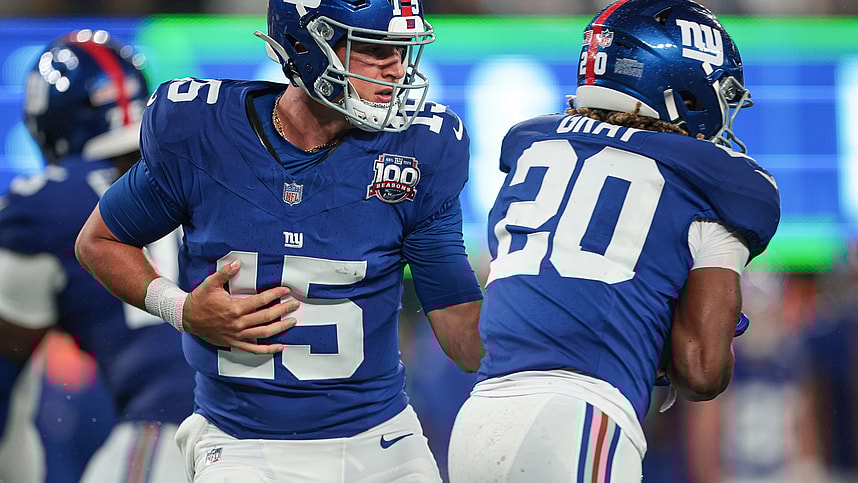 Aug 8, 2024; East Rutherford, New Jersey, USA; New York Giants quarterback Tommy DeVito (15) hands off to running back Eric Gray (20) during the first half at MetLife Stadium. Mandatory Credit: Vincent Carchietta-USA TODAY Sports
