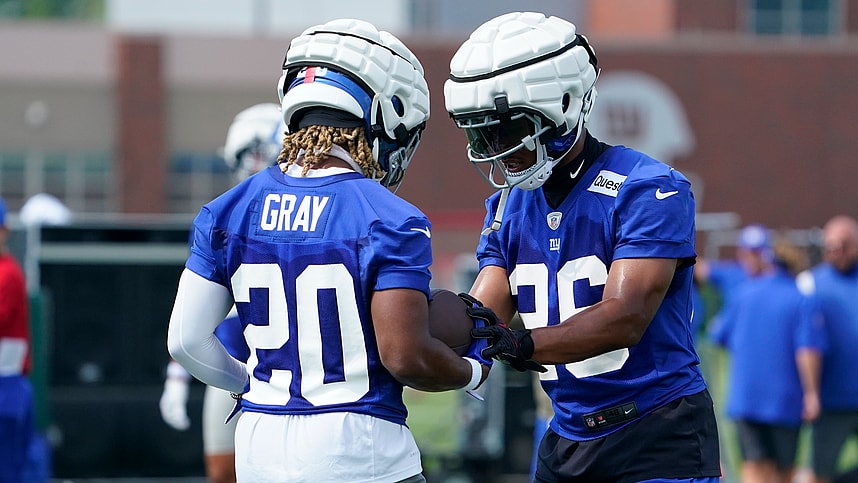 Jul 27, 2023; East Rutherford, NJ, USA;  New York Giants running back Saquon Barkley (26) works with rookie running back Eric Gray (20) on day two of training camp at the Quest Diagnostics Training Facility. Mandatory Credit: Danielle Parhizkaran-USA TODAY Sports