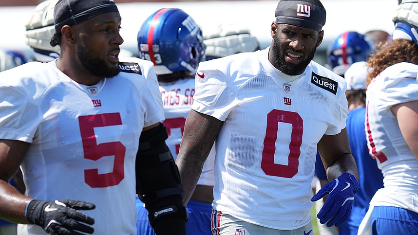 Jul 26, 2024; East Rutherford, NJ, USA; New York Giants linebacker Kayvon Thibodeaux (5) and New York Giants linebacker Brian Burns (0) break on the sideline during training camp at Quest Diagnostics Training Center. Mandatory Credit: Lucas Boland-USA TODAY Sports