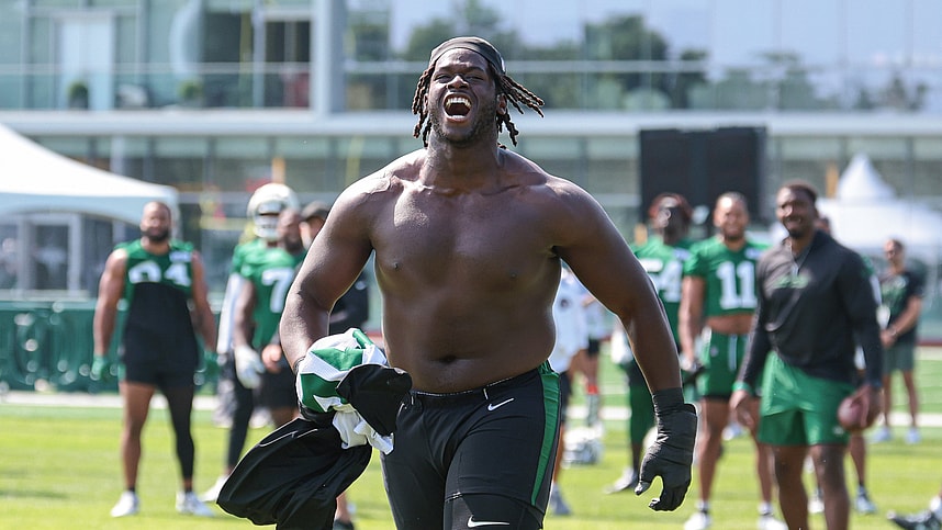 Jul 27, 2024; Florham Park, NJ, USA; New York Jets offensive tackle Olu Fashanu (74) runs up field greeting fans during training camp at Atlantic Health Jets Training Center. Mandatory Credit: Vincent Carchietta-USA TODAY Sports