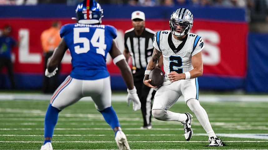 Aug 18, 2023; East Rutherford, New Jersey, USA; Carolina Panthers quarterback Matt Corral (2) tries to get past New York Giants linebacker Dyontae Johnson (54) during the third quarter at MetLife Stadium. Mandatory Credit: John Jones-USA TODAY Sports