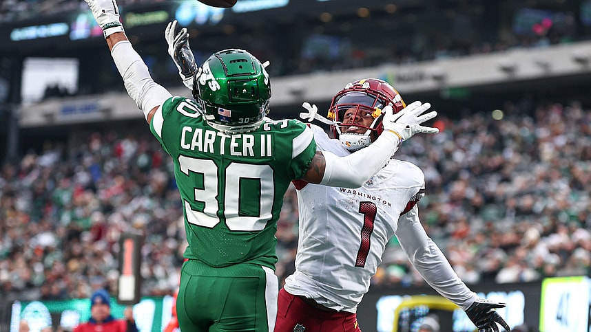 Dec 24, 2023; East Rutherford, New Jersey, USA; New York Jets cornerback Michael Carter II (30) breaks up a pass intended for Washington Commanders wide receiver Jahan Dotson (1) during the second half at MetLife Stadium. Mandatory Credit: Vincent Carchietta-USA TODAY Sports