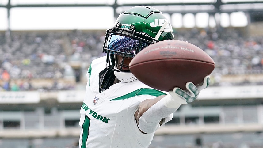 New York Jets cornerback Sauce Gardner (1) catches the ball during warmups before a game against the New England Patriots.