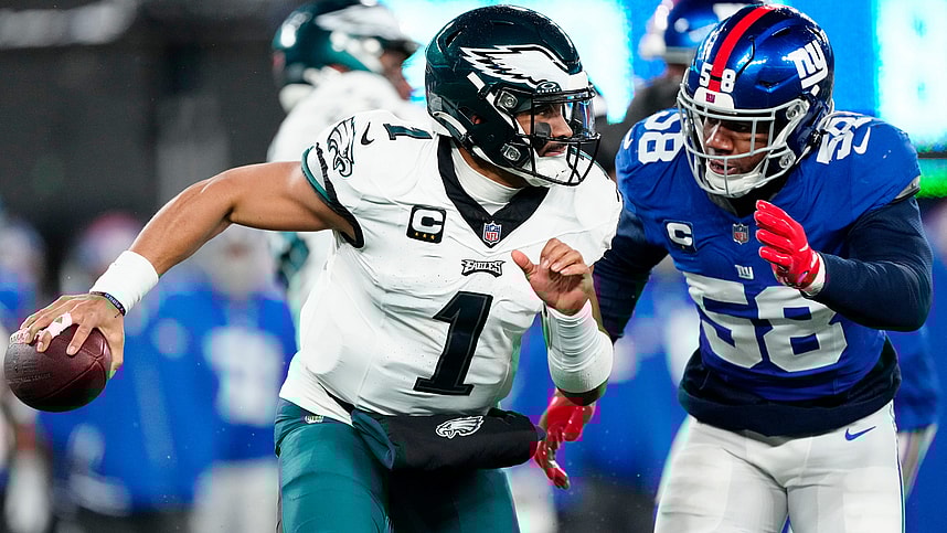 New York Giants linebacker Bobby Okereke (58) goes after Philadelphia Eagles quarterback Jalen Hurts (1) just before sacking him in the second quarter, Sunday, January 7, 2024.
