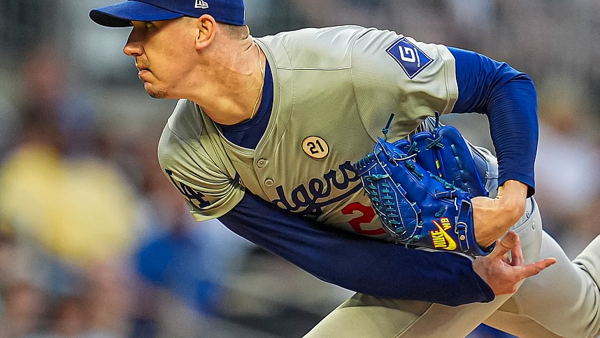 Sep 15, 2024; Cumberland, Georgia, USA; Los Angeles Dodgers starting pitcher Walker Buehler (21) pitches against the Atlanta Braves during the first inning at Truist Park. Mandatory Credit: Dale Zanine-Imagn Images