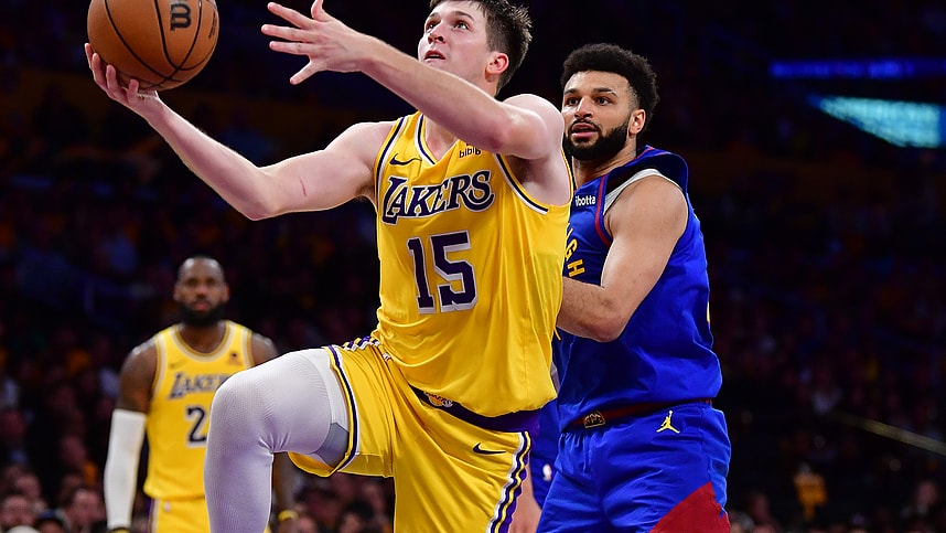 Apr 25, 2024; Los Angeles, California, USA; Los Angeles Lakers guard Austin Reaves (15) shoots ahead of Denver Nuggets guard Jamal Murray (27) during the second half in game three of the first round for the 2024 NBA playoffs at Crypto.com Arena. Mandatory Credit: Gary A. Vasquez-Imagn Images