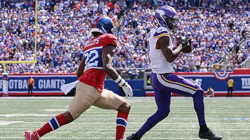 Sep 8, 2024; East Rutherford, New Jersey, USA; Minnesota Vikings wide receiver Jordan Addison (3) catches the ball in front of New York Giants cornerback Dru Phillips (22) during the first half at MetLife Stadium. Mandatory Credit: Vincent Carchietta-Imagn Images