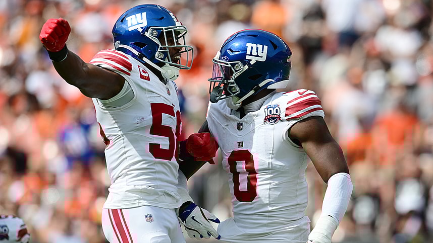 Sep 22, 2024; Cleveland, Ohio, USA; New York Giants linebacker Bobby Okereke (58) and linebacker Brian Burns (0) celebrate after Burns strip sacked Cleveland Browns quarterback Deshaun Watson (not pictured) during the first half at Huntington Bank Field. Mandatory Credit: Ken Blaze-Imagn Images