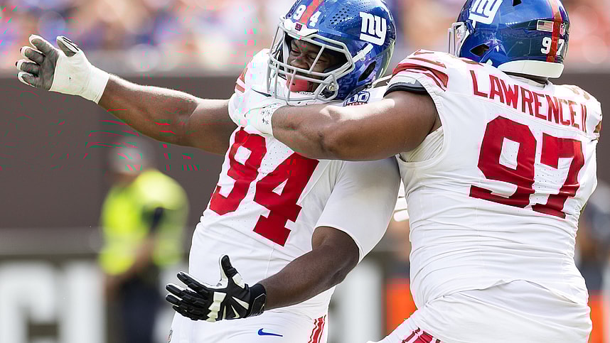 Sep 22, 2024; Cleveland, Ohio, USA; New York Giants defensive tackle Dexter Lawrence II (97) congratulates defensive tackle Elijah Chatman (94) on his sack against the Cleveland Browns during the first quarter at Huntington Bank Field. Mandatory Credit: Scott Galvin-Imagn Images