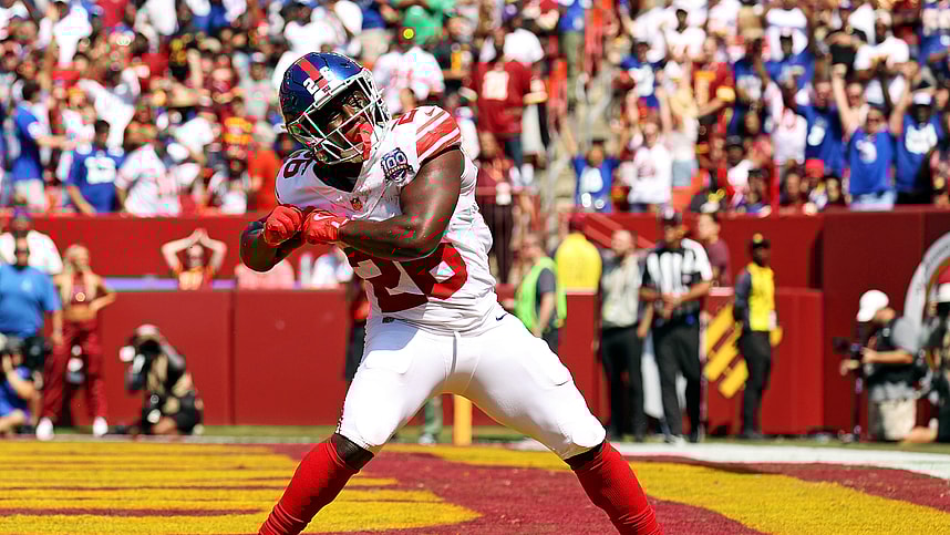 Sep 15, 2024; Landover, Maryland, USA; New York Giants running back Devin Singletary (26) celebrates after scoring a touchdown during the first quarter against the Washington Commanders at Commanders Field. Mandatory Credit: Peter Casey-Imagn Images