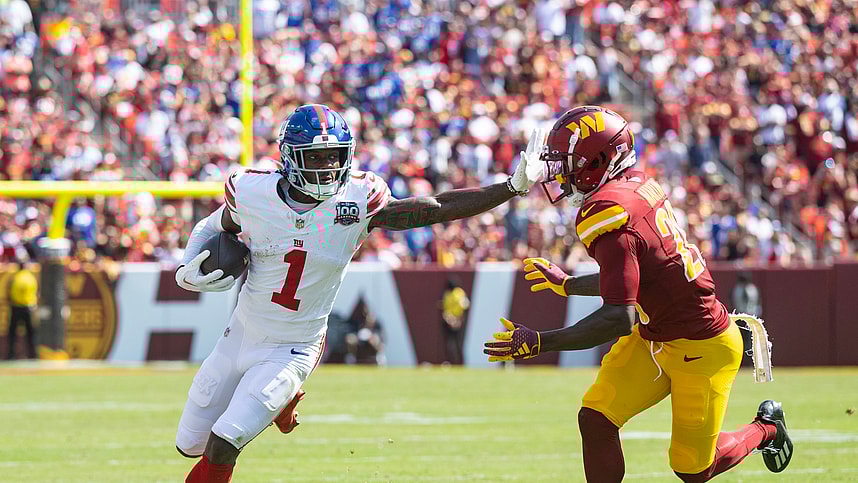 Sep 15, 2024; Landover, Maryland, USA; New York Giants wide receiver Malik Nabers (1) runs down the field pressured by Washington Comanders defensive back Juan Martin (20) in the first half at Commanders Field. Mandatory Credit: Luke Johnson-Imagn Images