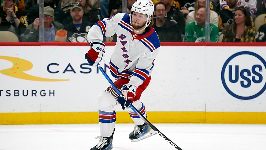 Mar 16, 2024; Pittsburgh, Pennsylvania, USA; New York Rangers defenseman Zac Jones (6) passes the puck against the Pittsburgh Penguins during the first period at PPG Paints Arena. New York won 7-4. Mandatory Credit: Charles LeClaire-Imagn Images