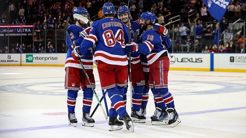 Sep 24, 2024; New York, New York, USA; New York Rangers center Adam Edstrom (84) celebrates game-winner goal with defenseman Jacob Trouba (8) and center Vincent Trocheck (16) during the third period against the New York Islanders at Madison Square Garden. Mandatory Credit: Danny Wild-Imagn Images