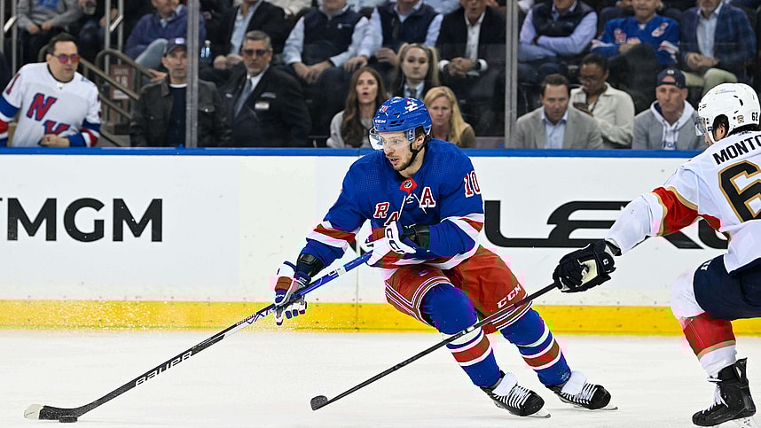 May 30, 2024; New York, New York, USA; New York Rangers left wing Artemi Panarin (10) skates with the puck as Florida Panthers defenseman Brandon Montour (62) defends during the third period in game five of the Eastern Conference Final of the 2024 Stanley Cup Playoffs at Madison Square Garden. Mandatory Credit: Dennis Schneidler-Imagn Images