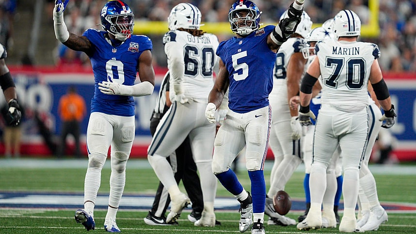 Sep 26, 2024; East Rutherford, NJ, US; New York Giants linebacker Brian Burns (0) and New York Giants linebacker Kayvon Thibodeaux (5) celebrate after sacking Dallas Cowboys quarterback Dak Prescott (4) at MetLife Stadium. Mandatory Credit: Julian Guadalupe-NorthJersey.com