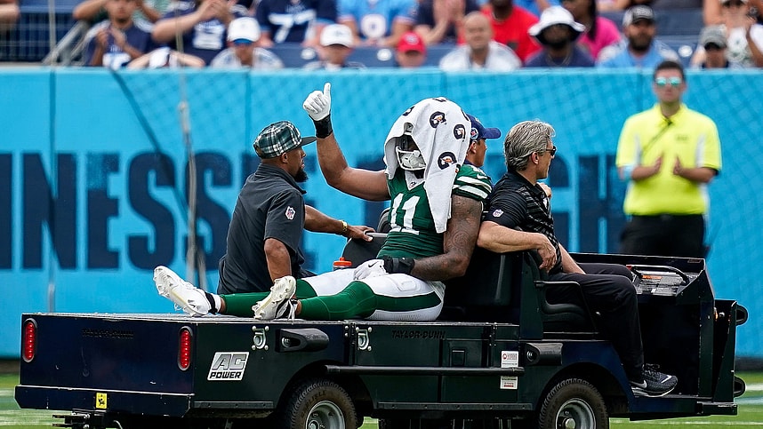 New York Jets linebacker Jermaine Johnson (11) exits the field after an injury during the third quarter against the Tennessee Titans at Nissan Stadium in Nashville, Tenn., Sunday, Sept. 15, 2024.