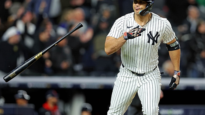 Oct 14, 2024; Bronx, New York, USA; New York Yankees designated hitter Giancarlo Stanton (27) hits a solo home run during the seventh inning against the Cleveland Guardians in game one of the ALCS for the 2024 MLB Playoffs at Yankee Stadium. Mandatory Credit: Brad Penner-Imagn Images
