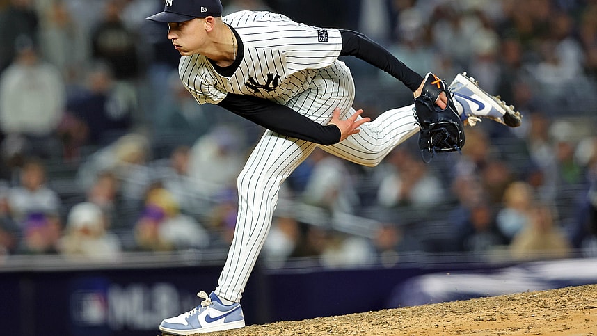 Oct 14, 2024; Bronx, New York, USA; New York Yankees pitcher Luke Weaver (30) pitches during the eighth inning against the Cleveland Guardians in game one of the ALCS for the 2024 MLB Playoffs at Yankee Stadium. Mandatory Credit: Brad Penner-Imagn Images