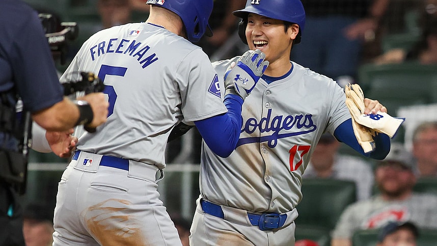 Sep 16, 2024; Atlanta, Georgia, USA; Los Angeles Dodgers first baseman Freddie Freeman (5) celebrates with designated hitter Shohei Ohtani (17) after a three-run home run against the Atlanta Braves in the seventh inning at Truist Park. Mandatory Credit: Brett Davis-Imagn Images