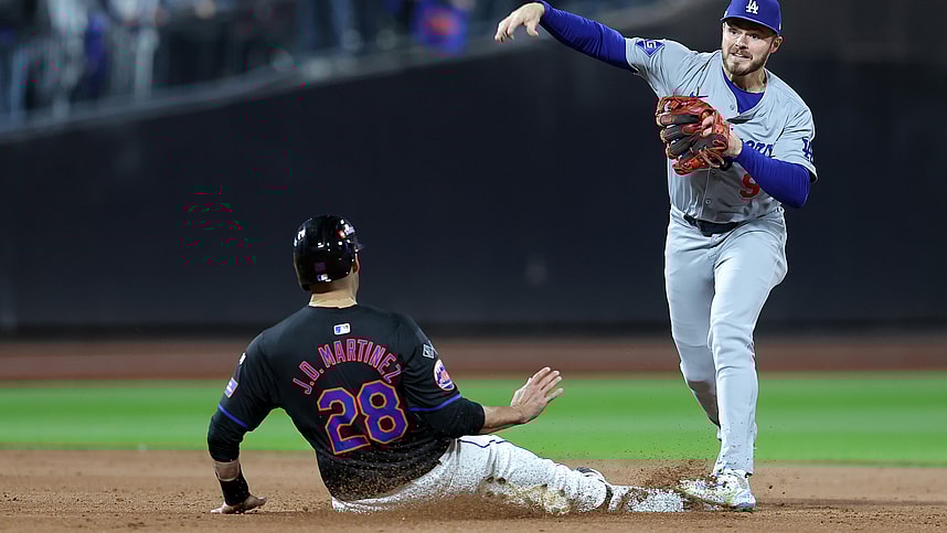 Oct 16, 2024; New York City, New York, USA; Los Angeles Dodgers second base Gavin Lux (9) gets a double play against New York Mets designated hitter J.D. Martinez (28) in the seventh inning during game three of the NLCS for the 2024 MLB playoffs at Citi Field. Mandatory Credit: Brad Penner-Imagn Images