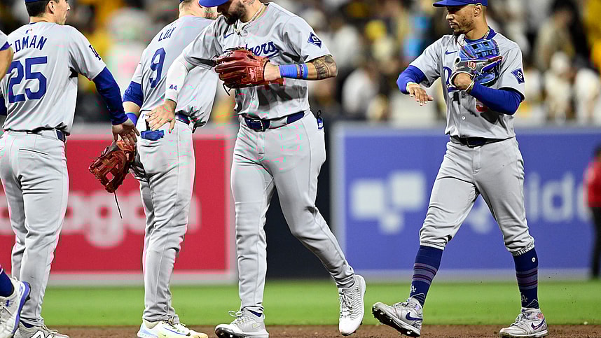 Oct 9, 2024; San Diego, California, USA; Los Angeles Dodgers outfielder Andy Pages (44) and shortstop Mookie Betts (50) celebrate with teammates after winning game four of the NLDS for the 2024 MLB Playoffs against the San Diego Padres at Petco Park.  Mandatory Credit: Denis Poroy-Imagn Images