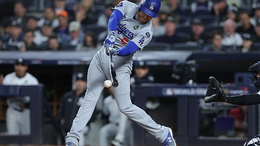 Oct 29, 2024; New York, New York, USA; Los Angeles Dodgers first baseman Freddie Freeman (5) hits a RBI fielders choice during the fifth inning against the New York Yankees in game four of the 2024 MLB World Series at Yankee Stadium. Mandatory Credit: Brad Penner-Imagn Images